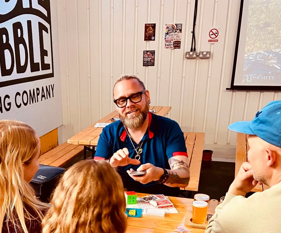 Shane Joseph performing close-up magic at a table event